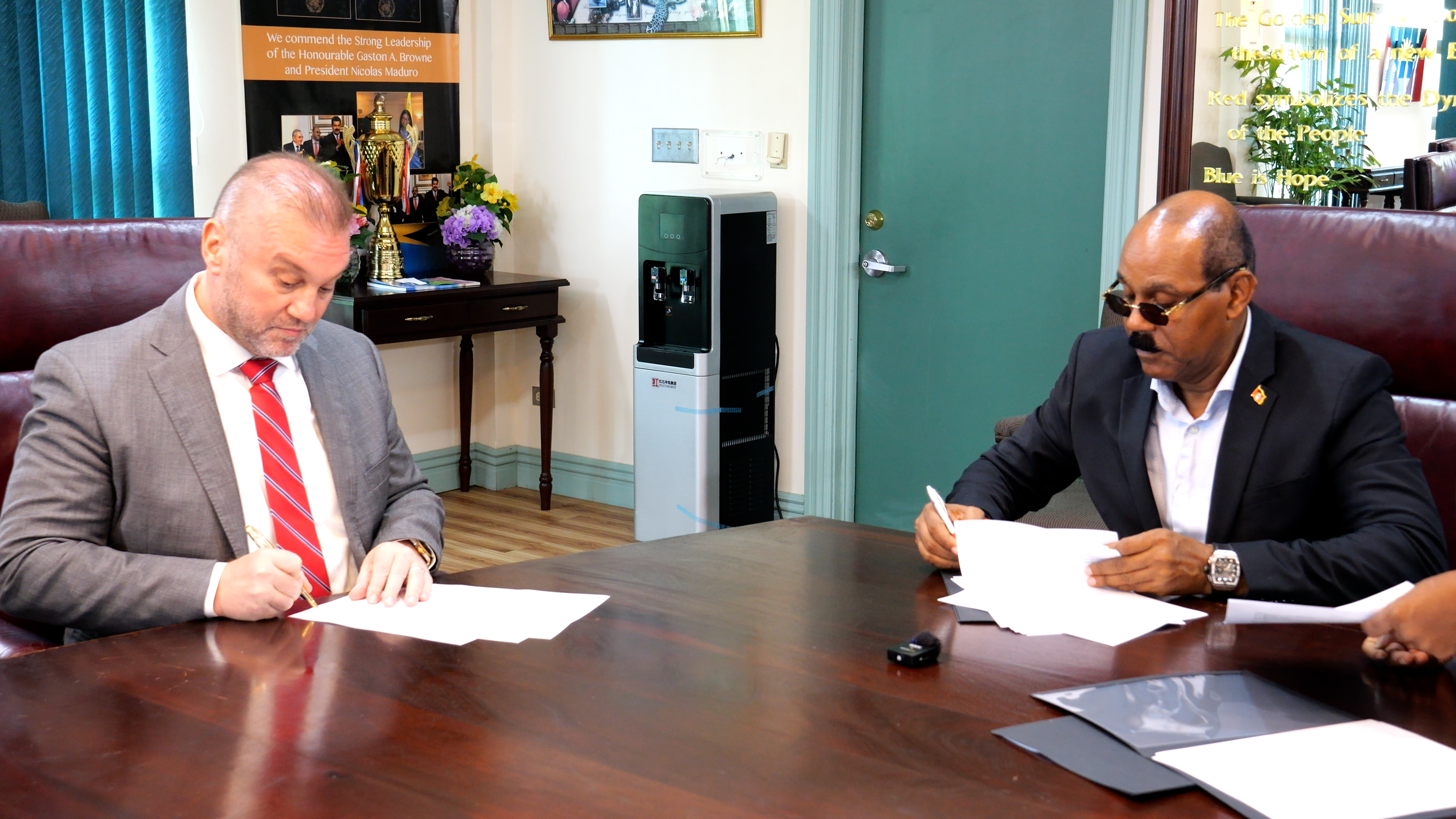 Prime Minister the Rt. Hon. Gaston Browne and Thomas Blenk, President and CEO of SolarisTech Inc., at the signing on 21 August 2026.
